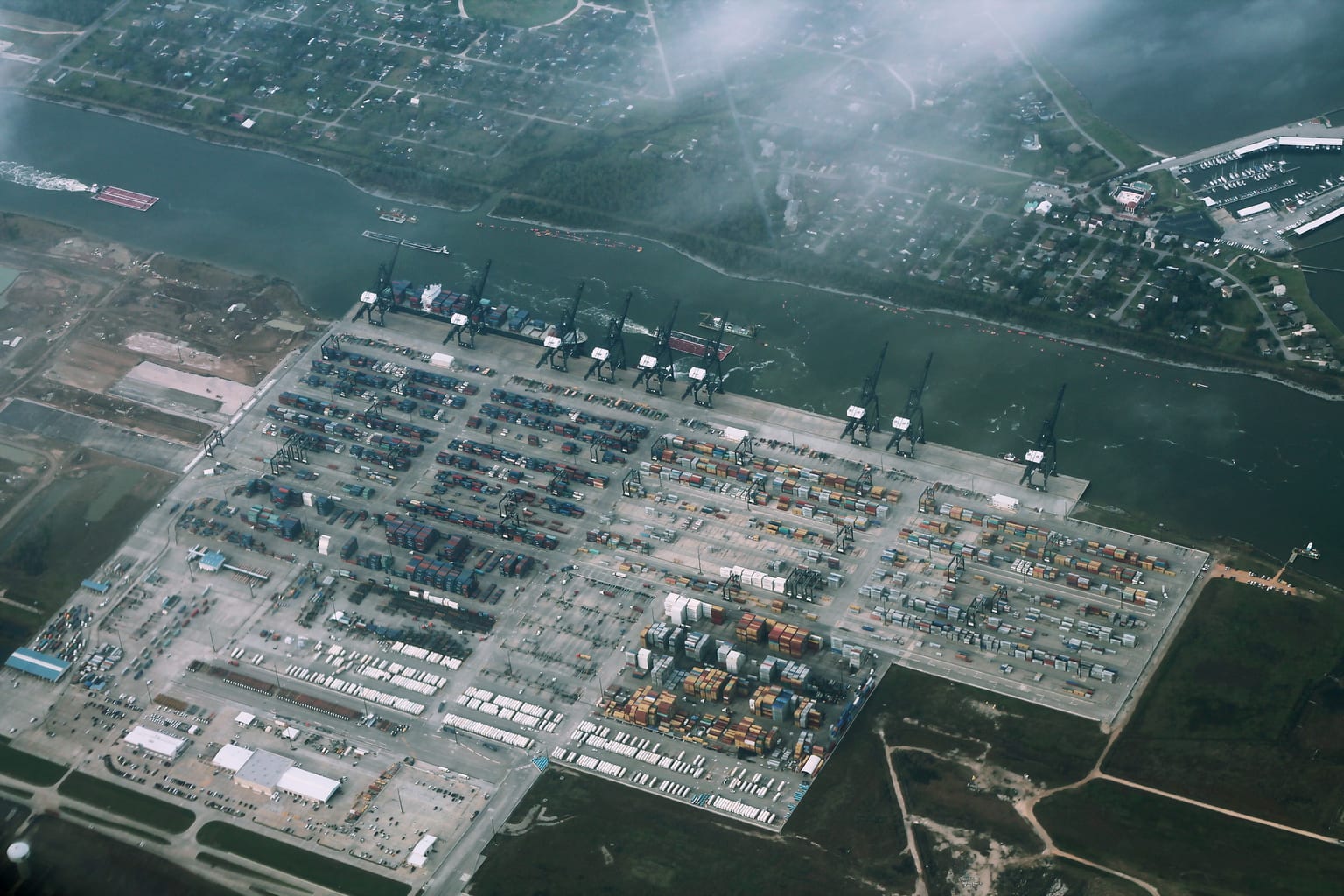 Container truck moving through a Houston port-market terminal lane