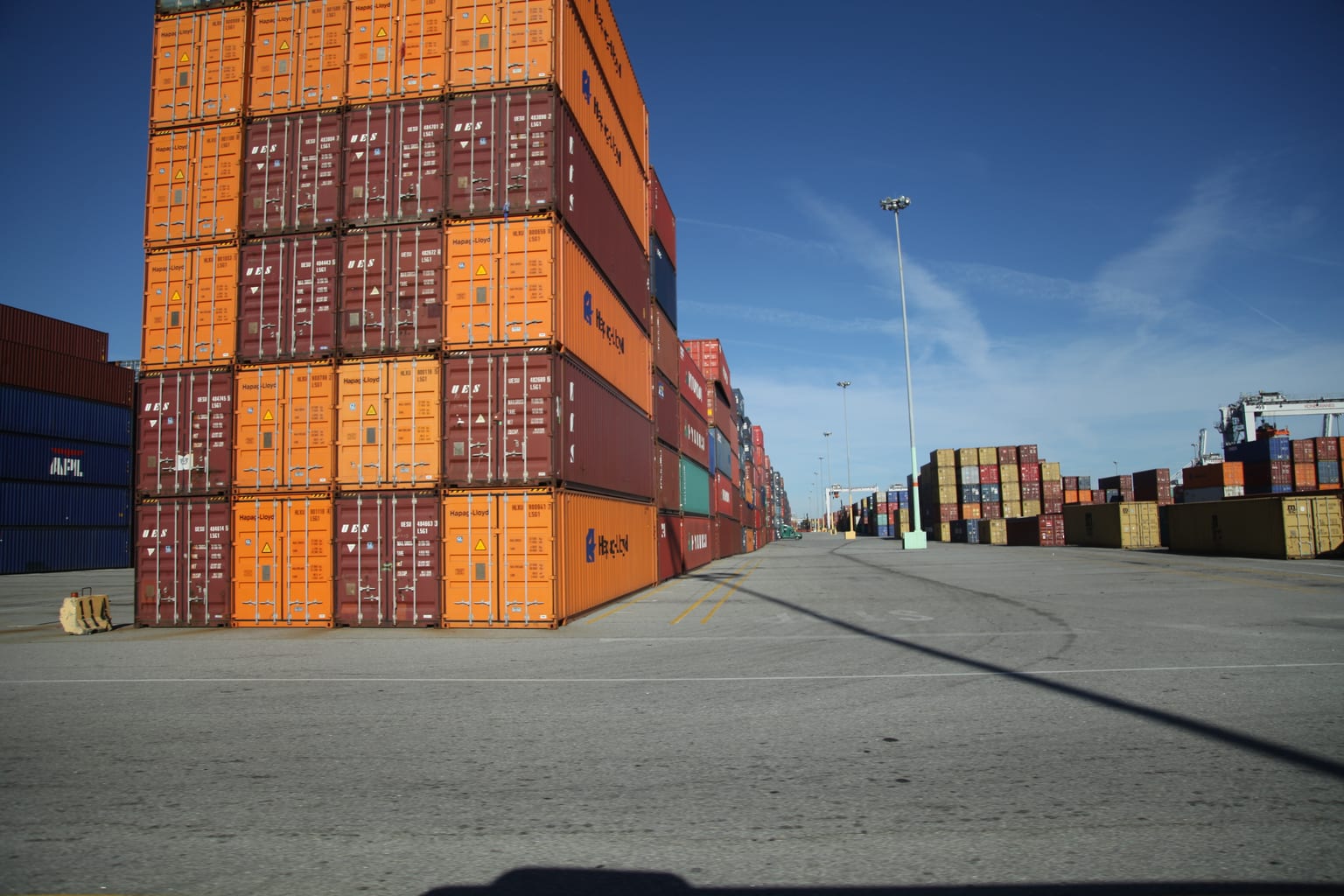 Container truck moving near a Savannah port-market terminal and warehouse lane